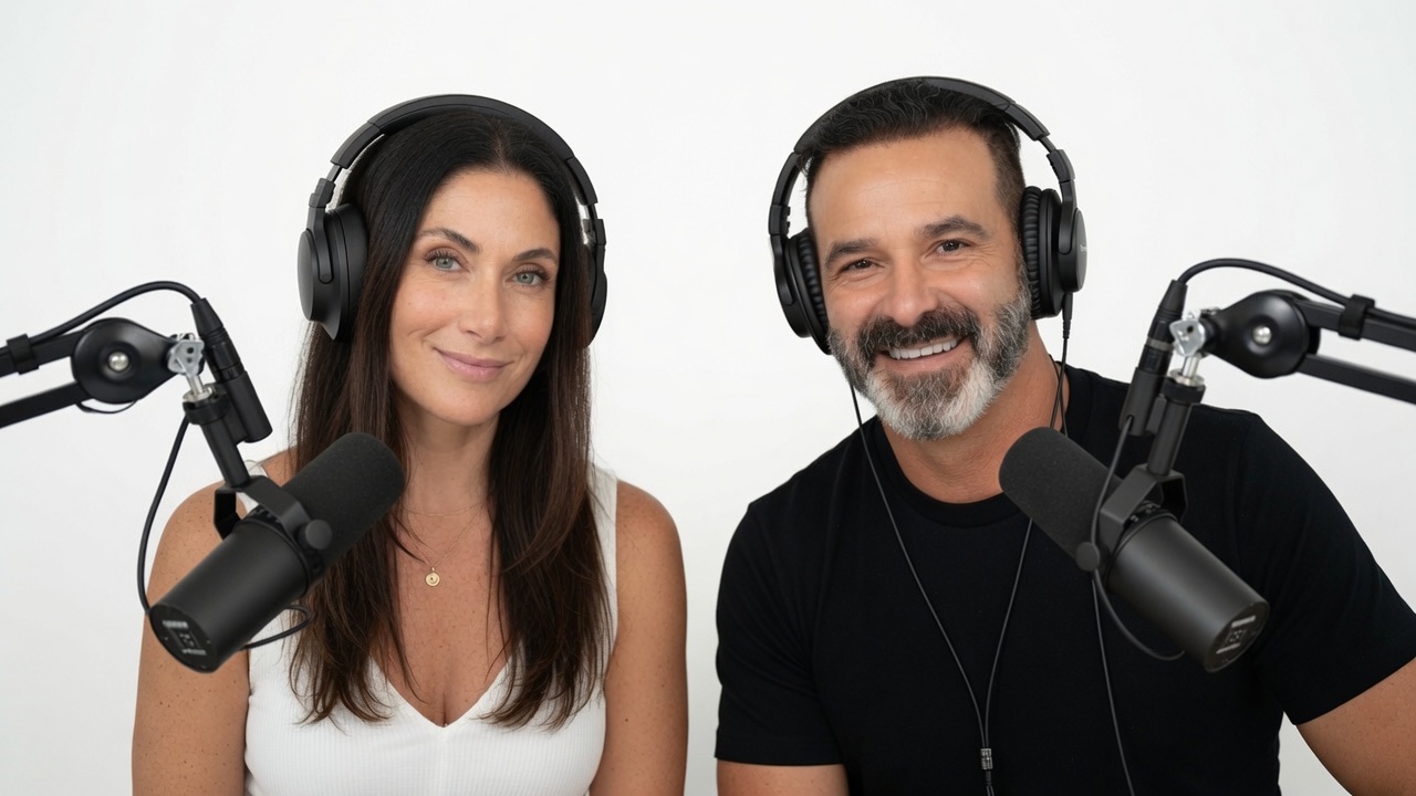 Jen and Rob behind podcast microphones
